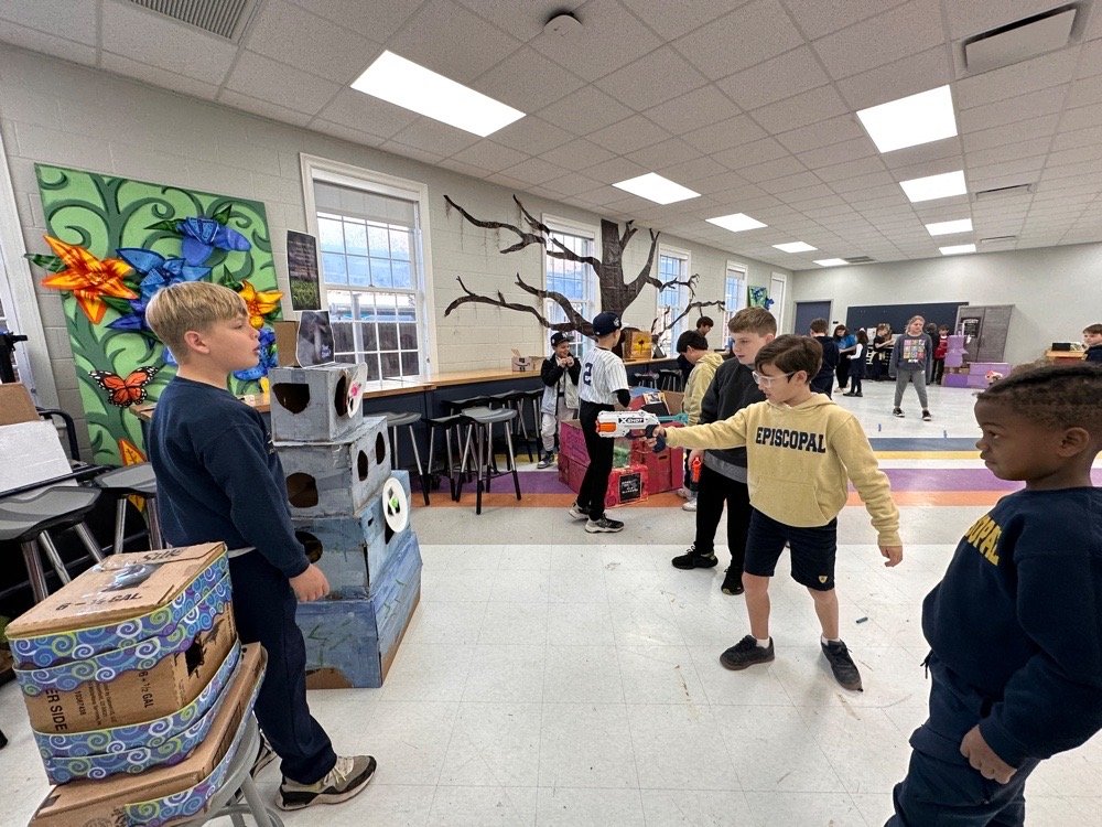 Students at cardboard arcade
